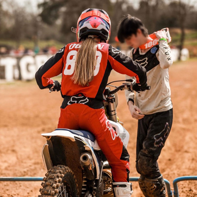Growing up, Ellie raced dirt bikes competitively and traveled frequently to Texas for training.